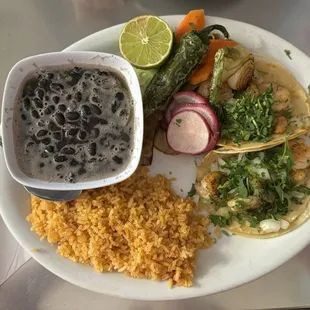 Delicious shrimp tacos with pickled vegetables and piping hot black beans; fluffy rice. It&apos;s my &quot; last meal&quot; meal.