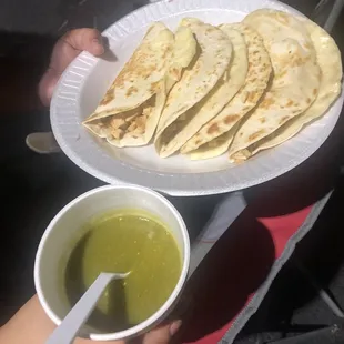 Quesadilla served with signature green salsa.