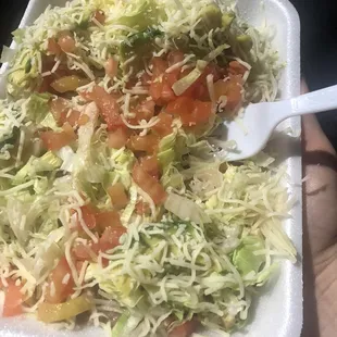 Bowl equivalent! Chicken, lettuce, tomato, avocado and beans. Tostadas served as side. Topped with plenty of finely shredded  cheese.