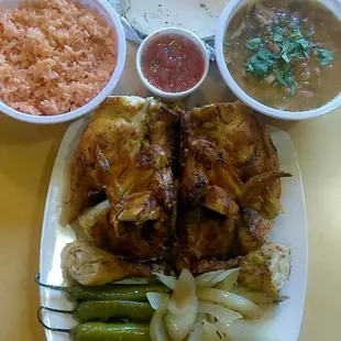 whole chicken 8pc, cooked onions, cooked chiles, beans with sausage and bacon, rice, red salsa, homemade corn tortilla 10.