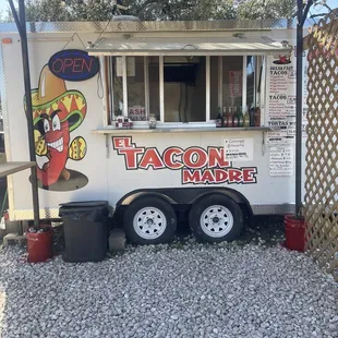 a taco truck parked in front of a building