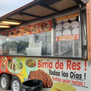 a food truck parked on the side of the road