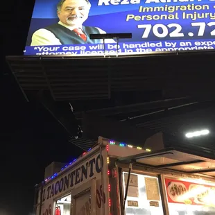 a man in a vest on a billboard