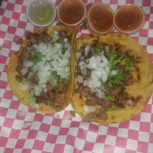 two tacos on a checkered paper