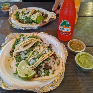 two plates of tacos on a table