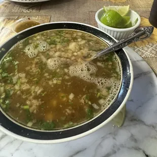 Consume de res with little bit of rice and garbanzo beans