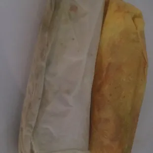 a close up of a burrito on a plate