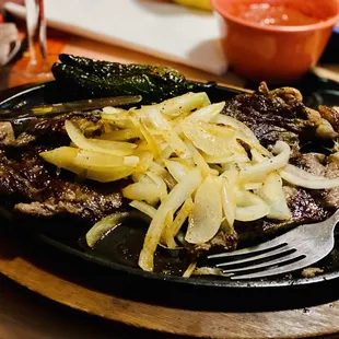RIBEYE carne asada w/grilled onions. Not on menu yet. Ask for it! :)..