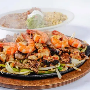 a plate of food and a bowl of rice