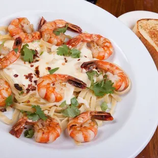 a plate of pasta and shrimp