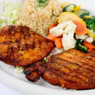 a plate of meat and vegetables