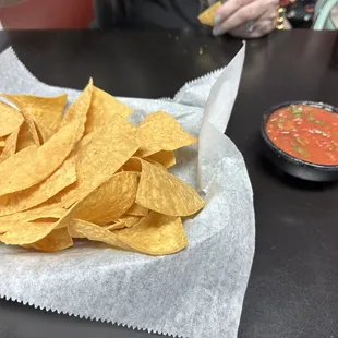 a plate of chips and salsa