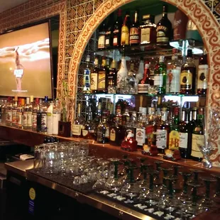 a bar with many bottles of alcohol