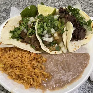 Barbacoa, Chicharrones, Lingua tacos with rice n beans.