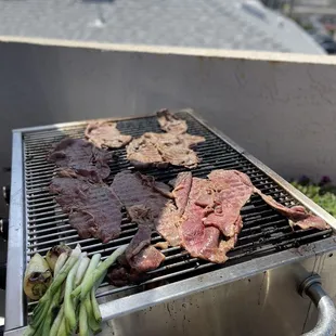 steaks on a grill