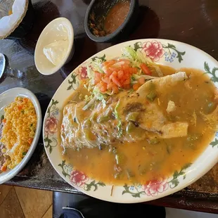 shredded beef burrito smothered in green chili no added cheese and a side of Mexican rice and beans