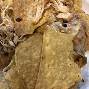 The chips in our nachos were stale and burned and the cheese was like plastic. We barely ate them.
