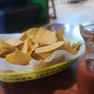 Deep basket of chips with salsa made in-house