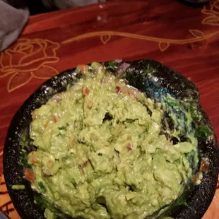 This is the guacamole . You pay $6.99 and a nice lady comes and makes it infront of you at your table on a traveling cart.