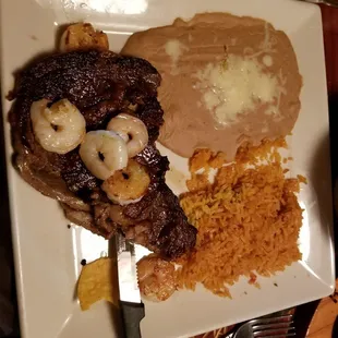 Steak with shrimp , rice and beans