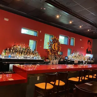 a bar with red counter tops