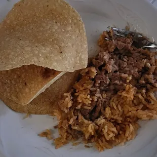 Here is the full order of beans and rice on a plate.