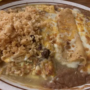 Rice, refried beans, chili rellenos and cheese enchiladas.