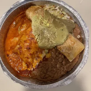 Ground beef flauta and carne asada enchilada with refried beans
