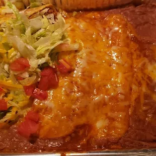 2 enchilada 1 taco beans only. Very good and delivered warm.