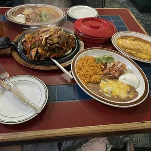 DELICIOUS! Combo fajitas for two comes with two orders of sides and choice of tortillas. And an ala carte cheese Enchilada.