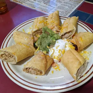 Chicken taquitos from the appetizer menu. Highly recommend. Beautiful chunks of tender cooked chicken. Super flavorful.