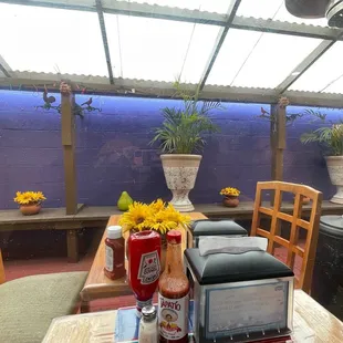 tables and chairs with sunflowers