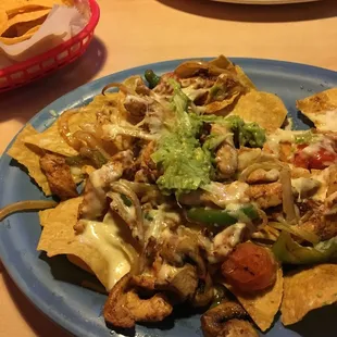 Chicken nachos. Guacamole added later.