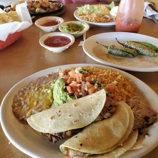Shrimp fajitas,   pork tacos