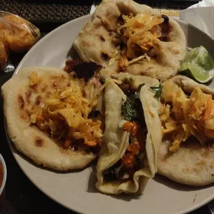 All three types of pupusas and a chorizo taco