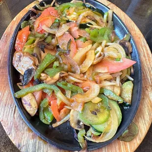 Veggie fajitas (served with rice, beans, lettuce, tomato, guac, tortillas)