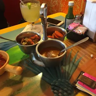 three bowls of food on a table