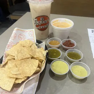 Salsa selection. Chips and queso. horchata