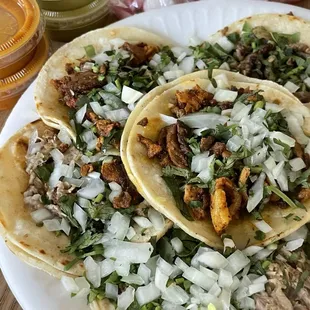 2 carnitas tacos  2 Al pastor tacos  2 asada tacos