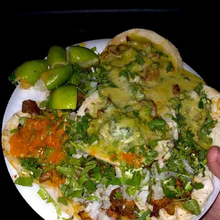Tacos with green and red salsa