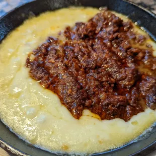 a skillet of food on a table