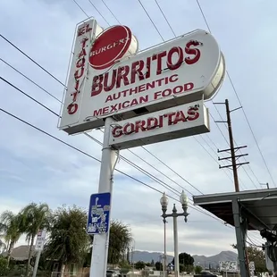 a sign for burritos