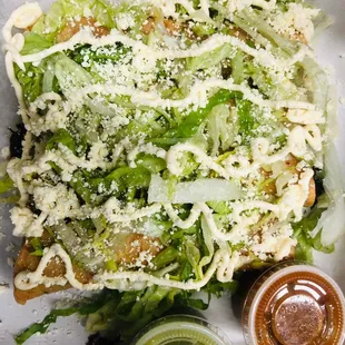 a close up of a salad in a styrofoam container