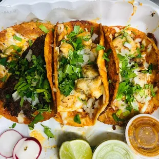 three fish tacos on a tray