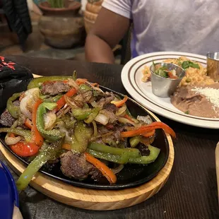 Churrasco fajitas with rice and beans and tortillas