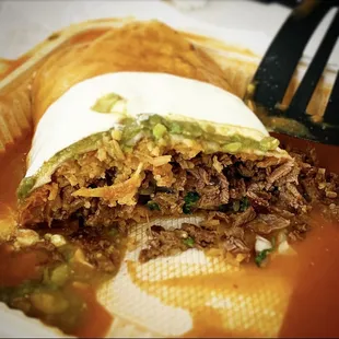 Half of a super burrito carne asada. So big I needed a spatula to transport it to the plate. Highly recommended.