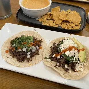 Barbacoa taco left, Beef Fajita right