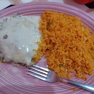 a plate of food with rice and meat