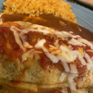 a plate of enchiladas and rice