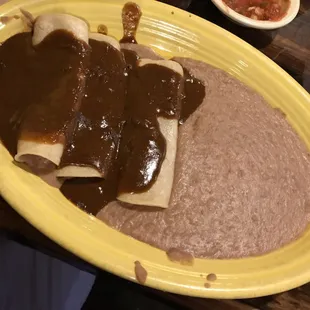 Enchiladas mole and refried beans